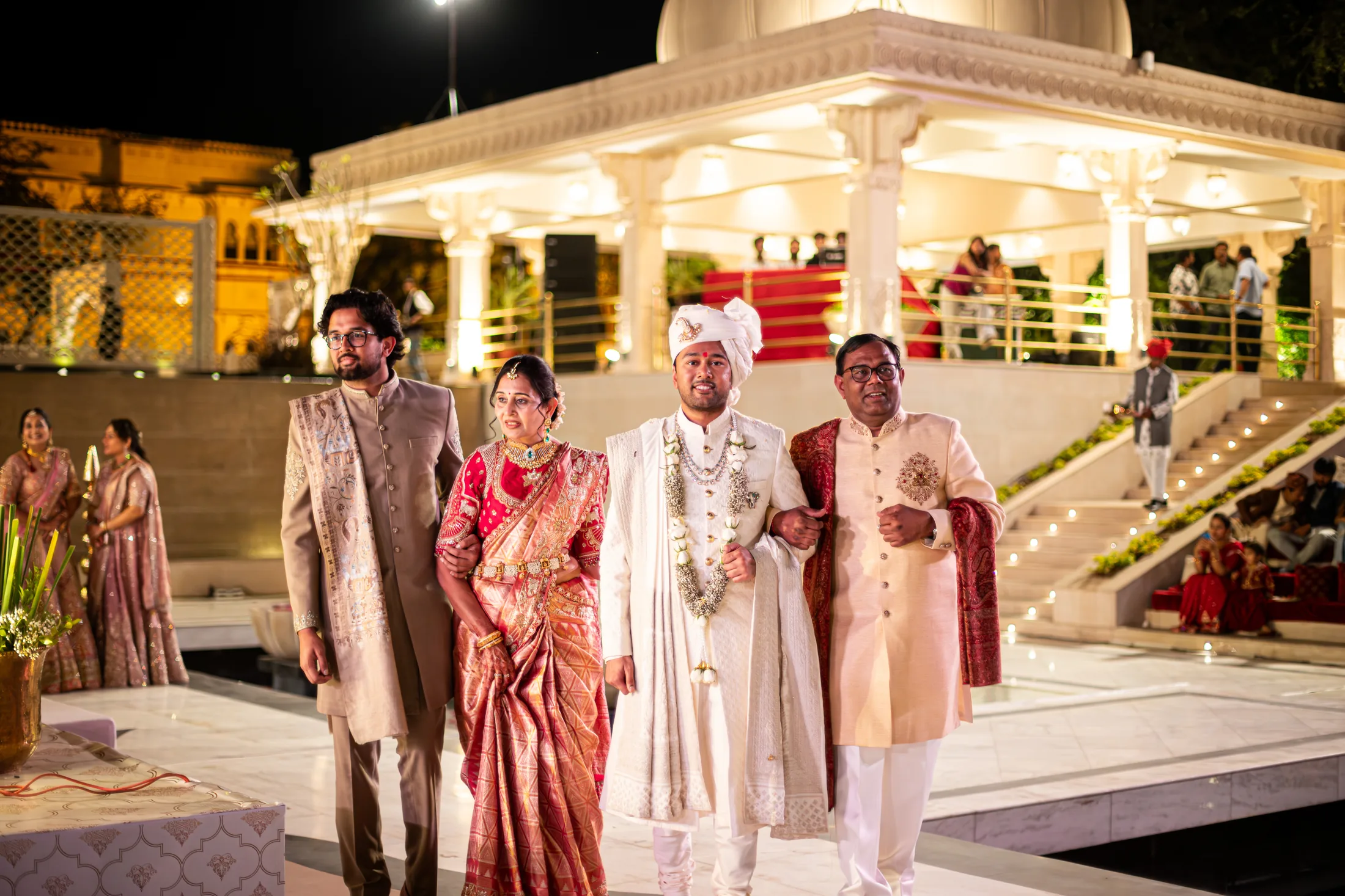 Jay walks with family during the nighttime wedding procession