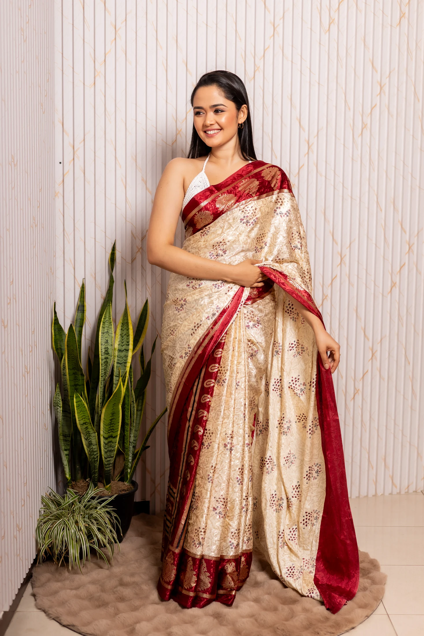 Model wearing an ivory and red Adare Clothing saree
