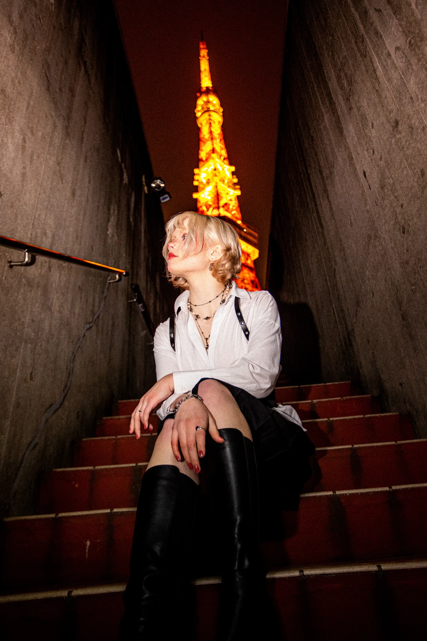 Ylva Brandt seated beneath Tokyo Tower at night