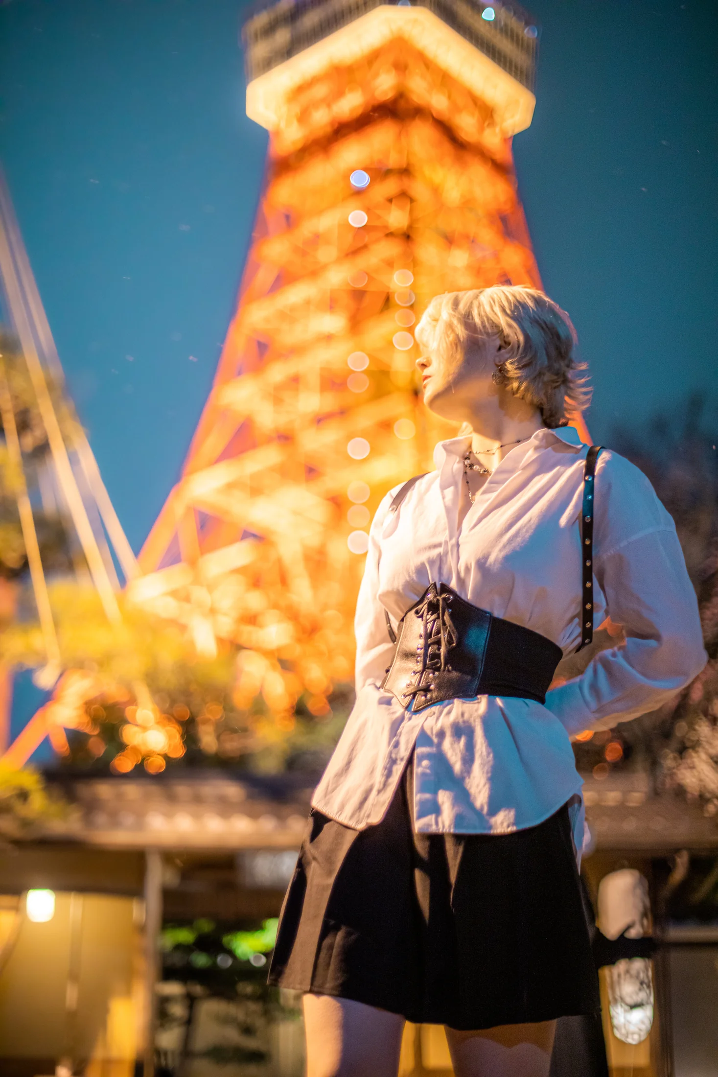 Ylva Brandt looking toward the glowing Tokyo Tower