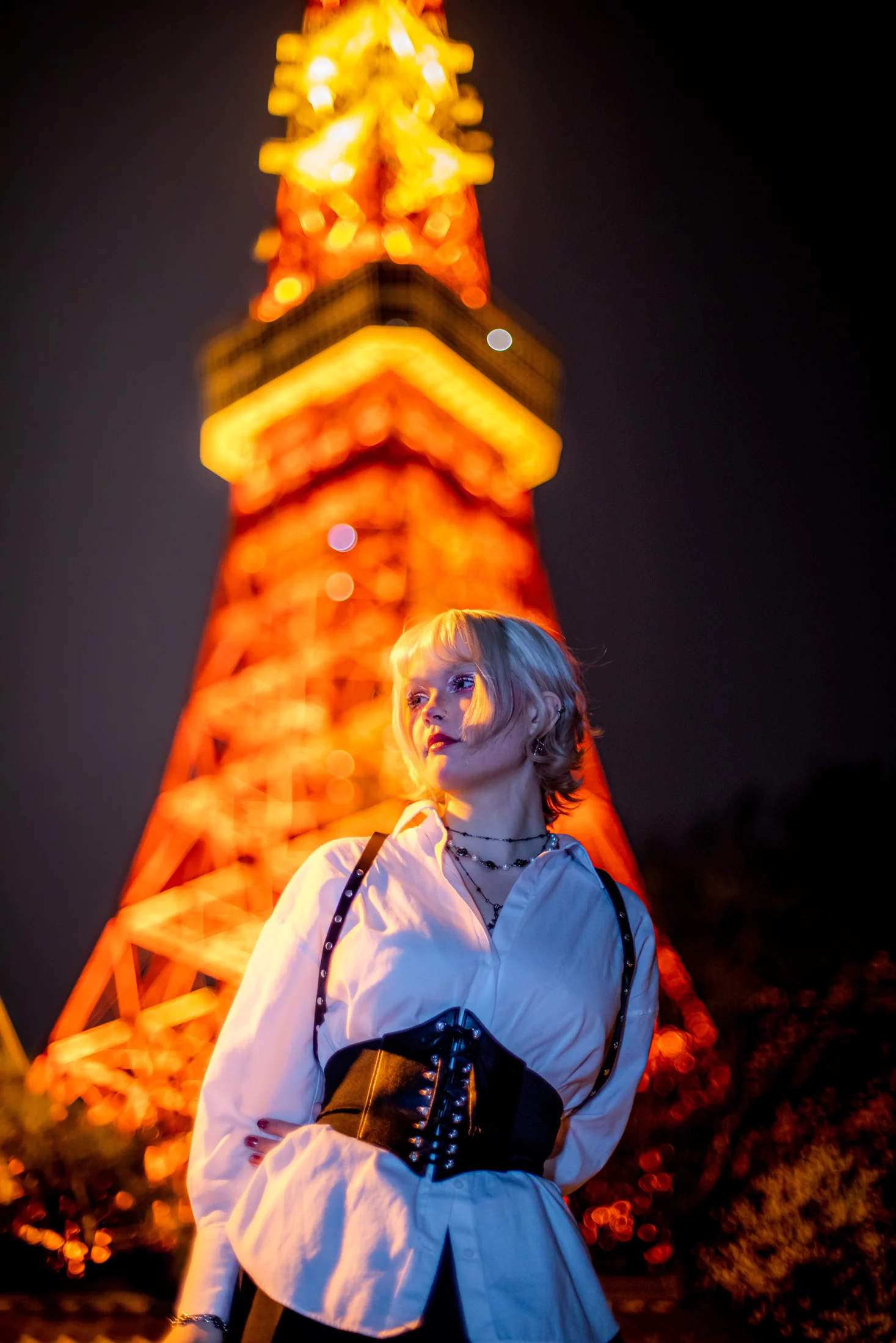 Ylva Brandt lit by the orange glow of Tokyo Tower